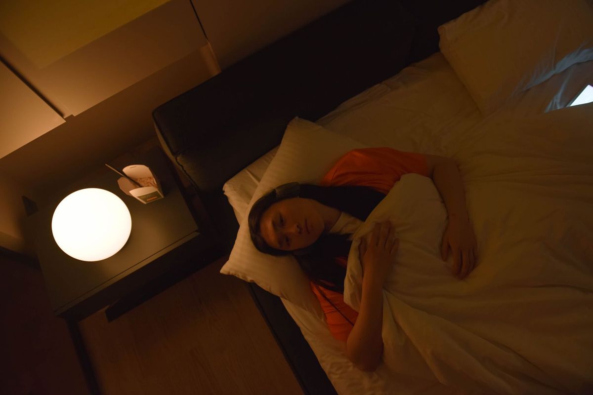 Personne réveillée la nuit dans son lit
